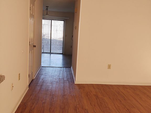 View to the dining area, kitchen and back patio.