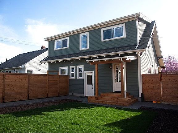 Backyard and covered rear entry off kitchen