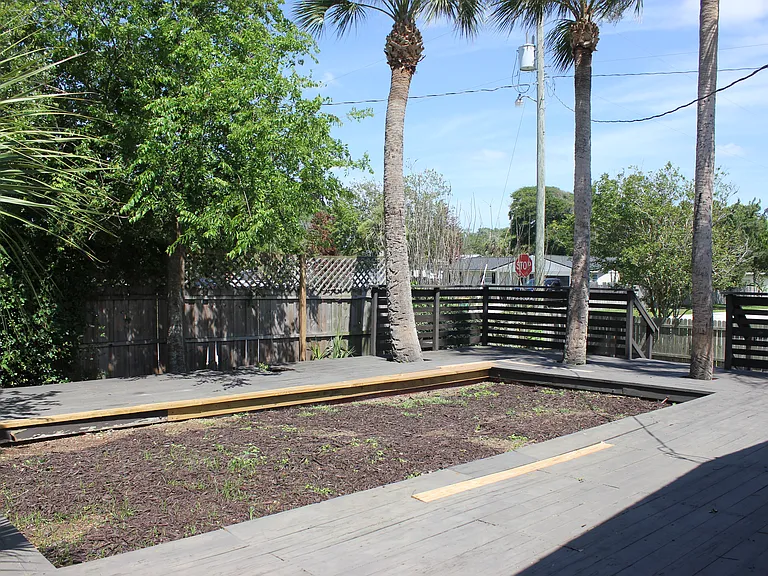 deck with space for a fire pit or corn hole
