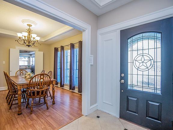 Details everywhere! Gorgeous front door, diagonally placed inset tile flooring, thick, crisp millwork and moldings throughout and freshly painted walls and white ceilings.