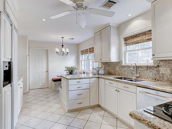 Off the kitchen is a breakfast room with built in bench seating.