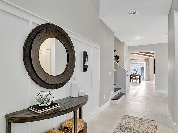 Welcoming foyer with decorative wall feature