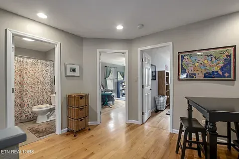 Hardwood floors upstairs with ceramic tile in the bathroom.