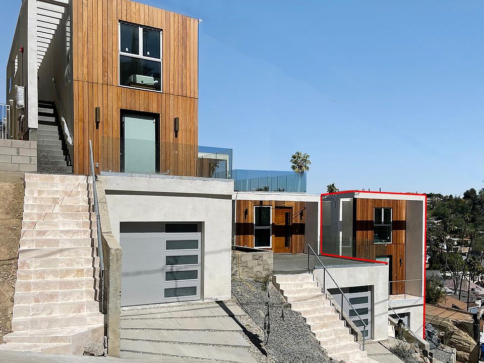 Front Garage in basement, house on bottom and ADU and deck on top