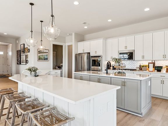 The kitchen of the Quincy II at Heritage Shores by Brookfield Residential.