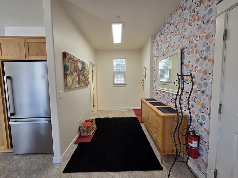 Mudroom leading to laundry room and half-bath.