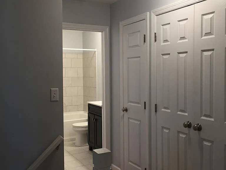 Hall with linen closet and extra closet.