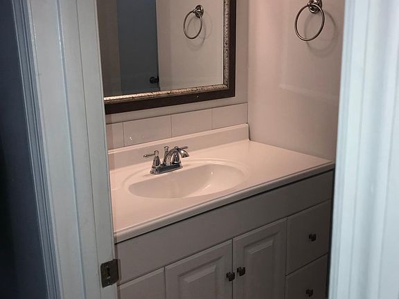 Full bath with new vanity and tile floor