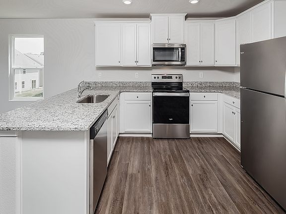 Stainless steel kitchen appliances are included