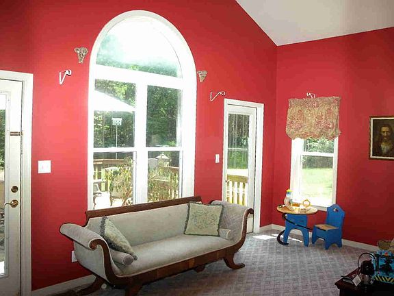 Bright Sunroom with vaulted ceiling.