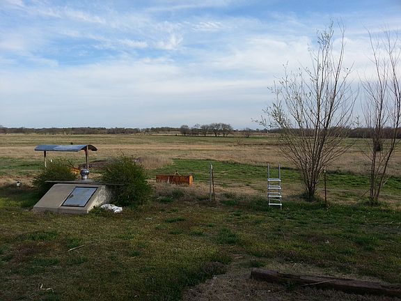 Back Yard with Storm Cellar