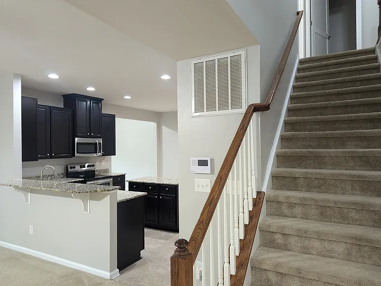 (New carpet on stairs and second floor not pictured)