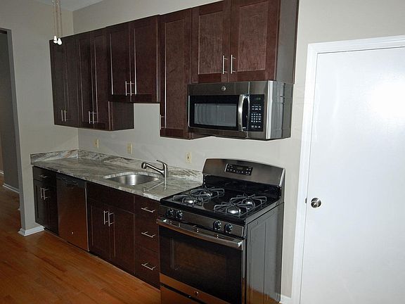 Updated kitchen with granite counters and stainless steel appliances