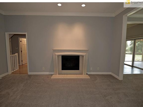 Living room looking dining to right and kitchen to left