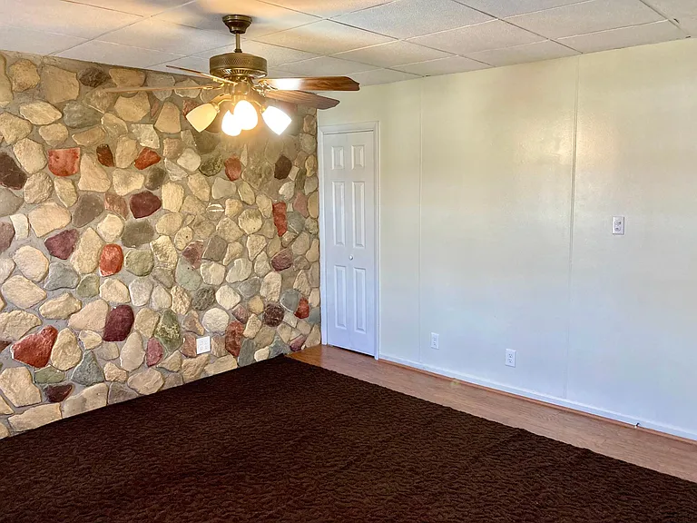decorative stone wall in master bedroom