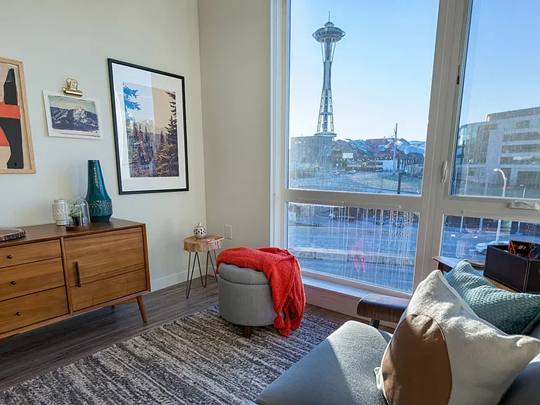 Floor to ceiling windows with city views.