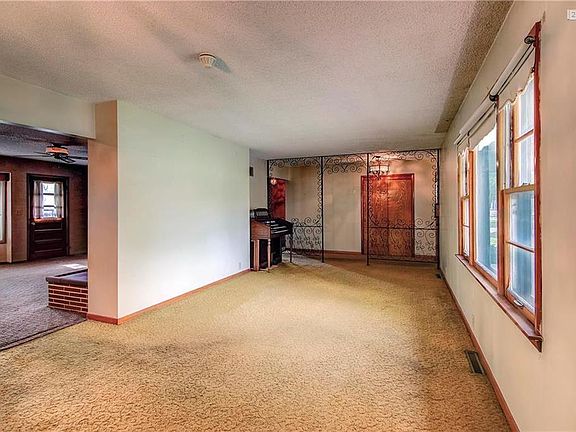 Large living area opens to family room, in back of home.