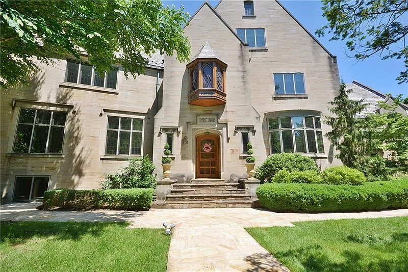 Lakewood House- is a majestic stone 1930 Tudor on a premier street in Fox Chapel