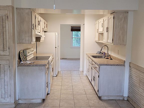 View of kitchen and past it the dining room taken from the big kitchen eating area.