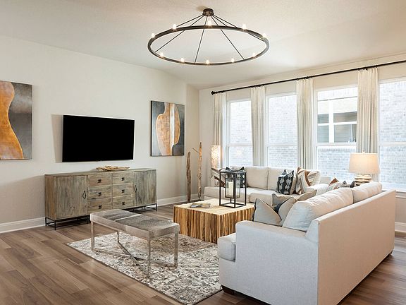 Enjoy a spacious living area with plenty of natural light in this great room.