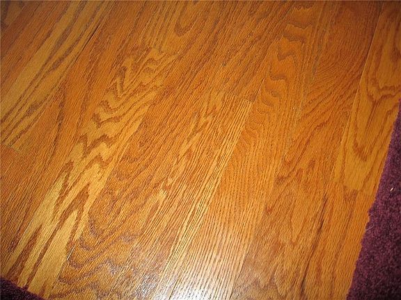 Foyer is hardwood, which is throughout the house under carpet