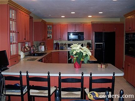 Kitchen with wall oven, pantry & many cabinets