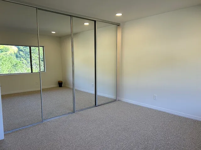 Closets behind mirrored doors. All closets have seperate lighting controls.