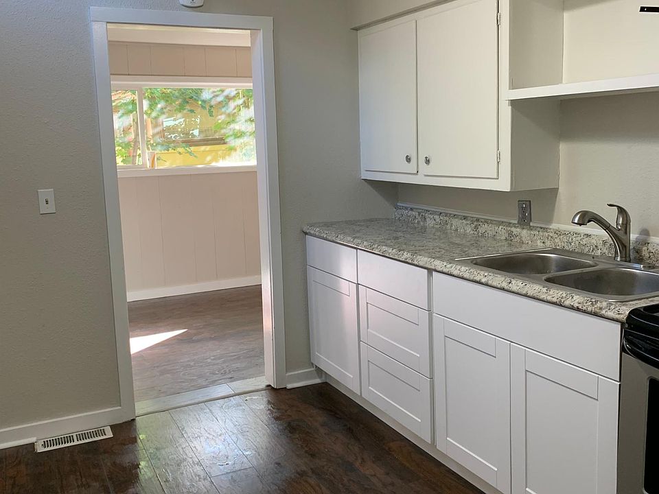 New lower cabinets, countertop and sink/faucet.