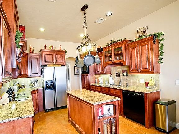 Custom cabinets and pot rack, pull out drawers, lazy susan