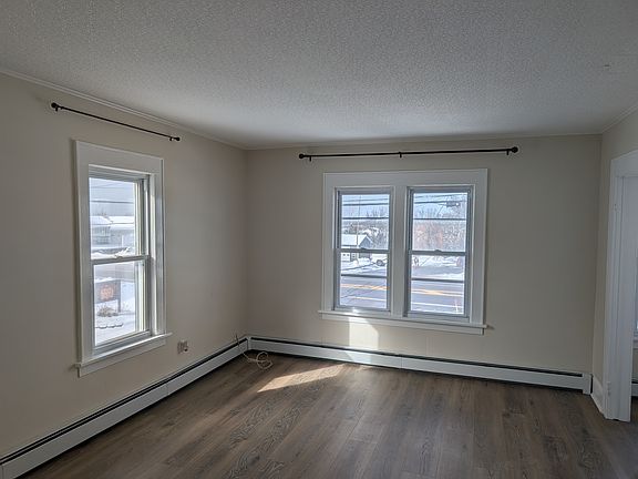 Living room with bright big windows.