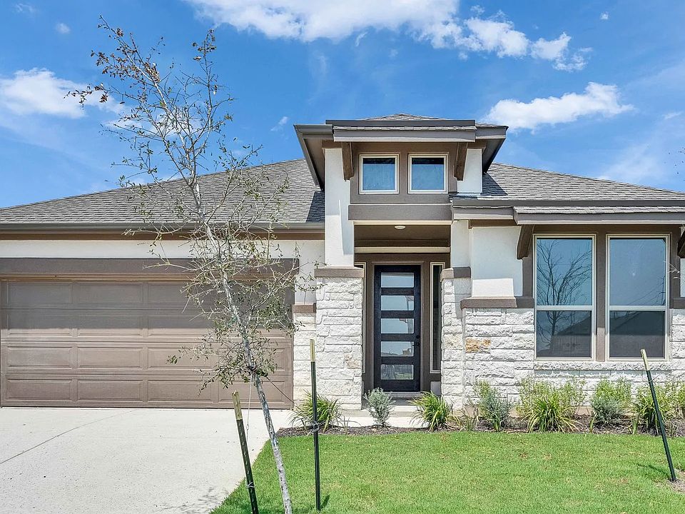 Impeccable stonework and sleek design define this home s elegant facade in Preserve at Lakeside Mead