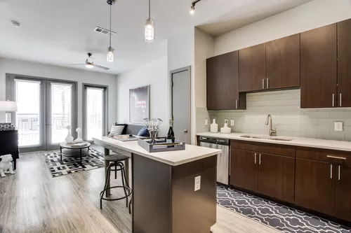 Modern kitchens feature quartz countertops and Whirlpool stainless steel appliances - Windsor West Lemmon