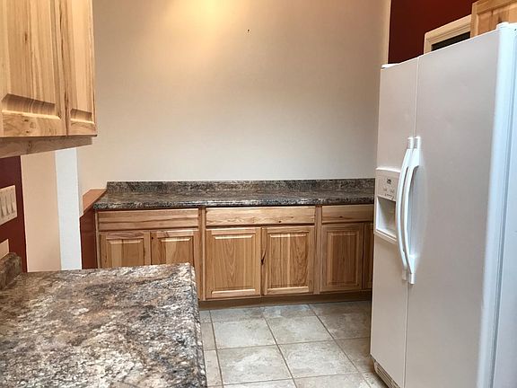 Kitchen -Looking toward shared wall and door to garage