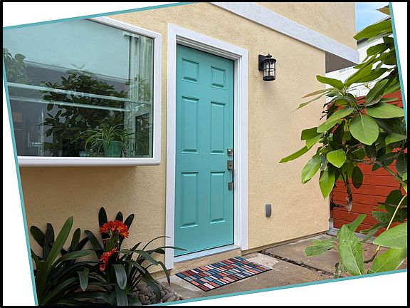 The garden window and front door of this brand-new studio.