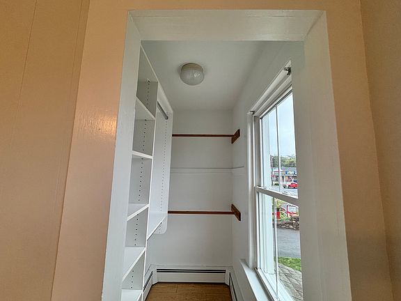 Primary bedroom walk-in closet
