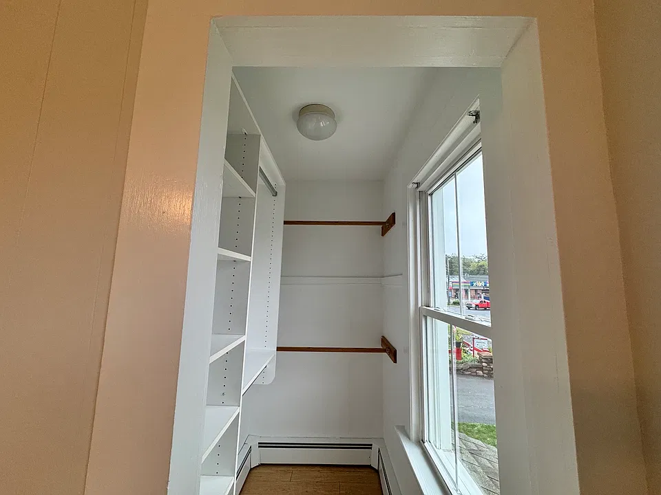 Primary bedroom walk-in closet