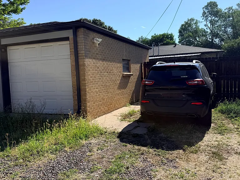 1 Garage Space + 1 Reserved Parking Space in Alley
