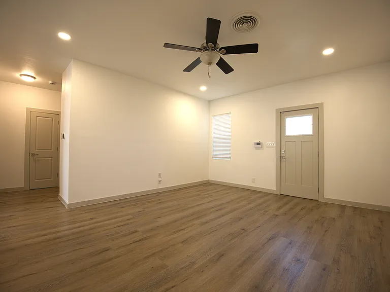 No carpet in entire unit! Family room with ceiling fan.