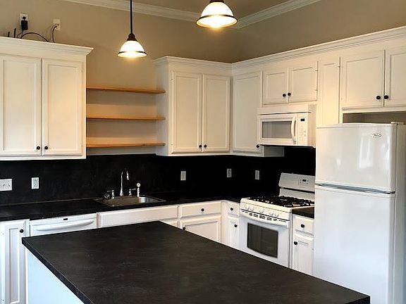 The kitchen has tons of work space and cabinet storage and if you like to entertain, the island is a perfect place for your friends to gather.