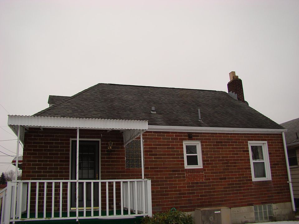 BACK OF HOME WITH SITTING PORCH