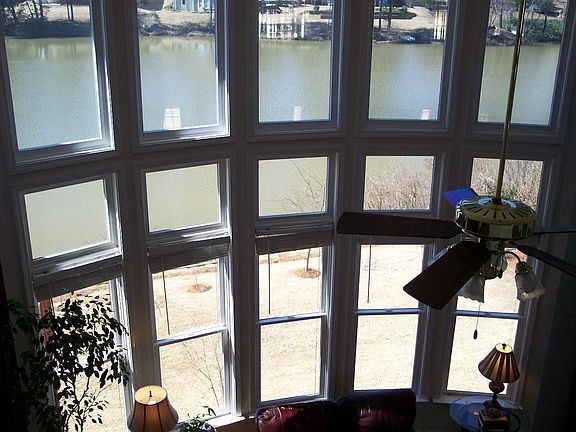 Family room with dramatic bowed wall of windows=more lake views