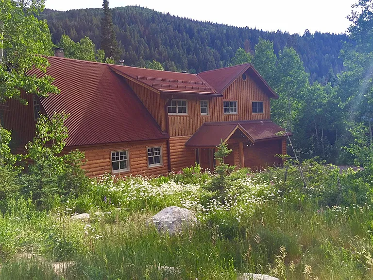 The studio is above the garage. The main house isn't used much. You can park in the garage when no one is using the house. Nice mountain views. Large windows.