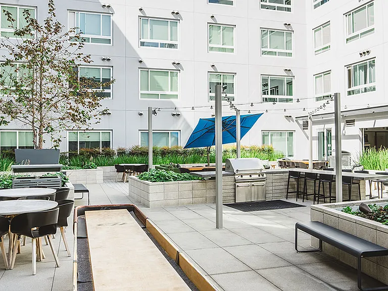 Outdoor lounge with grilling stations, shuffle board, and more!