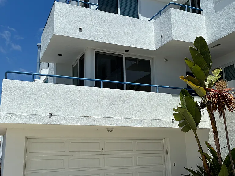 Private large 2 car garage with storage cabinets.