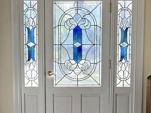 From inside the vestibule looking through the stained glass.
