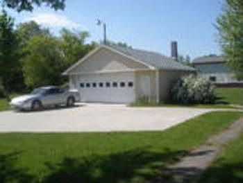 detached 2 car garage with additional storage in back