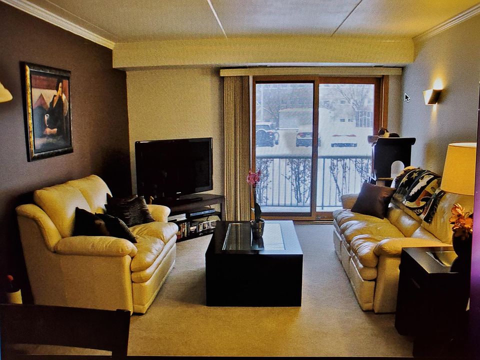 With furniture. Update with hardwood floors and white walls as shown in other picture.