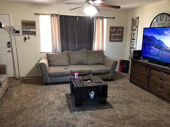 Living room with carpet and large windows!
