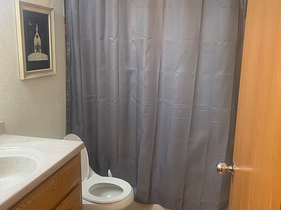 Warm bathroom with baseboard heating and excellent water pressure.