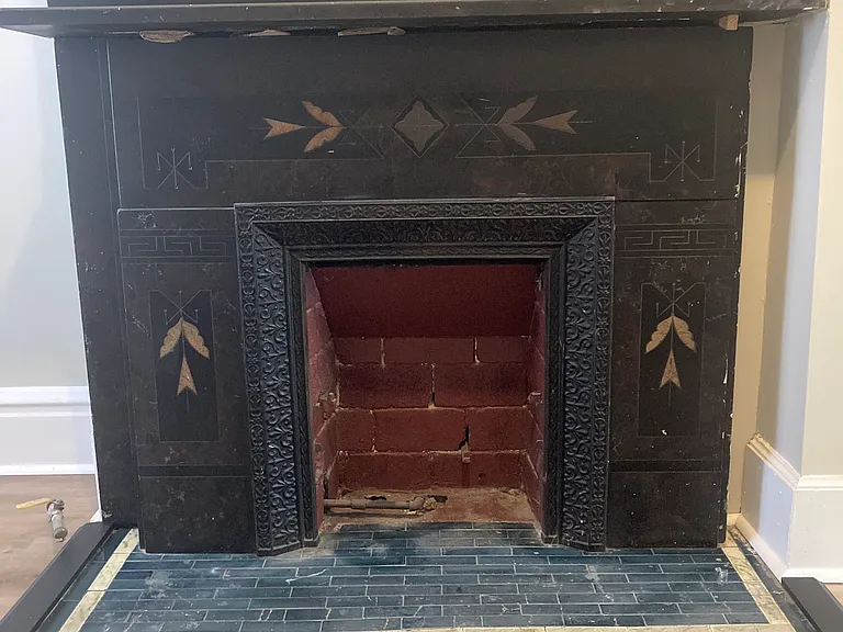 Original slate fireplace in the living room.